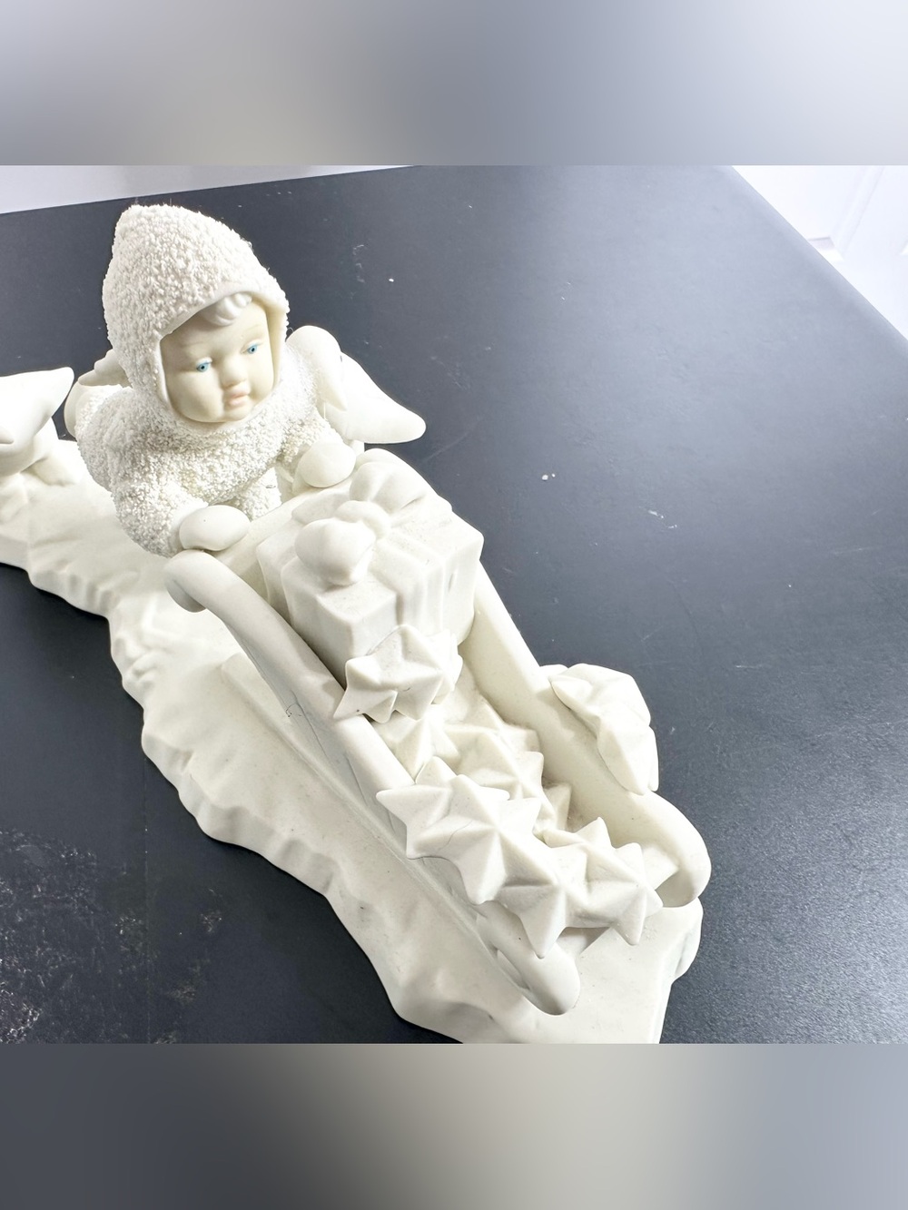 Department 56 Cream Ceramic Angel child on Sled Figurine